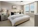 Comfortable bedroom showcasing neutral tones, soft natural light, and contemporary furnishings at 4665 Parkarbor Ave, Las Vegas, NV 89141