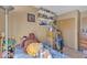 A cozy bedroom with carpet flooring and a collection of shelves at 468 Potomac St, Henderson, NV 89015