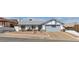 Charming single-story home featuring a gray roof, two-car garage, and a desert landscape at 468 Potomac St, Henderson, NV 89015