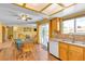 Bright kitchen featuring a sink, dining table with chairs, and sliding glass door at 468 Potomac St, Henderson, NV 89015