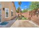 Backyard features artificial turf and a play structure for Gathering enjoyment at 4878 Friar Tuck Ave, Las Vegas, NV 89130