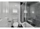 Bathroom featuring a glass enclosed shower and black and white marble look accents at 4878 Friar Tuck Ave, Las Vegas, NV 89130
