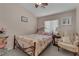 Cozy bedroom featuring a decorative iron bed frame and soft, inviting decor at 4878 Friar Tuck Ave, Las Vegas, NV 89130