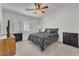 Cozy bedroom with ceiling fan, plantation shutters and neutral colors that create a serene and inviting space at 4878 Friar Tuck Ave, Las Vegas, NV 89130