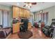 Inviting home office with built-in desk and storage, hardwood floors, and comfortable seating at 4878 Friar Tuck Ave, Las Vegas, NV 89130