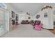 Open living room with fireplace, plush seating, and seamless transition to other rooms, providing a welcoming space at 4878 Friar Tuck Ave, Las Vegas, NV 89130