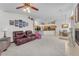 Bright living room featuring cozy seating, a ceiling fan, and an open layout with seamless transitions at 4878 Friar Tuck Ave, Las Vegas, NV 89130