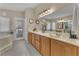 Bathroom featuring dual sinks, ample counter space, and modern fixtures, creating a clean and functional space at 4878 Friar Tuck Ave, Las Vegas, NV 89130