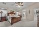 Cozy bedroom features carpet, a ceiling fan, and ample natural light, creating a relaxing atmosphere at 4878 Friar Tuck Ave, Las Vegas, NV 89130