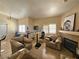 Living room has tile floors, multiple windows, fireplace and neutral colored walls at 5225 W Reno Ave # 210, Las Vegas, NV 89118