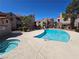 A large community pool and spa area is surrounded by desert landscaping at 5225 W Reno Ave # 210, Las Vegas, NV 89118