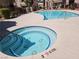 Community spa is surrounded by desert landscaping with a clear sky overhead at 5225 W Reno Ave # 210, Las Vegas, NV 89118