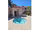 Community spa is surrounded by desert landscaping with a clear sky overhead at 5225 W Reno Ave # 210, Las Vegas, NV 89118