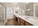 Bathroom with double sink vanity and a separate tub and glass shower at 5265 Lucca Ln, Pahrump, NV 89061