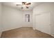 Bedroom with plush carpet, a ceiling fan, and a window for natural lighting at 5265 Lucca Ln, Pahrump, NV 89061