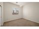 Carpeted bedroom featuring a window with blinds and a chandelier at 5265 Lucca Ln, Pahrump, NV 89061