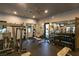 Well-equipped gym with weight machines, free weights, mirror, and black rubber flooring at 5265 Lucca Ln, Pahrump, NV 89061