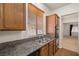 Kitchen area featuring granite countertops, a double sink, and natural lighting at 5265 Lucca Ln, Pahrump, NV 89061