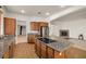Open concept kitchen with stainless steel appliances, granite countertops, and a cooktop island at 5265 Lucca Ln, Pahrump, NV 89061