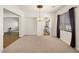 Spacious open living room showcasing a chandelier and views into the kitchen at 5265 Lucca Ln, Pahrump, NV 89061