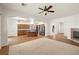 Spacious living room featuring tile floors, a fireplace, and a ceiling fan at 5265 Lucca Ln, Pahrump, NV 89061