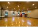 Spacious yoga studio with hardwood floors and natural light, perfect for group fitness at 5265 Lucca Ln, Pahrump, NV 89061