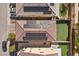 Bird's-eye view showcasing a home with modern solar panels, a well-kept roof, and an artificial backyard lawn at 5419 Holding Ave, Las Vegas, NV 89139