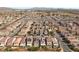 Expansive aerial view of a well-planned community with uniform homes and desert landscaping, showcasing neighborhood layout at 5419 Holding Ave, Las Vegas, NV 89139