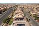 Aerial view featuring properties with solar panels, landscaped yards, and a well-planned community layout at 5419 Holding Ave, Las Vegas, NV 89139
