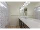 Bathroom featuring a long vanity with a granite countertop and a shower with a curtain at 5419 Holding Ave, Las Vegas, NV 89139