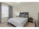 Inviting bedroom featuring a comfortable bed, bedside tables, and a relaxing ambiance at 5419 Holding Ave, Las Vegas, NV 89139