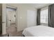 Cozy bedroom with a neutral color palette, plush carpet, and ample natural light at 5419 Holding Ave, Las Vegas, NV 89139