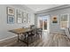 Dining area with stylish table, chairs, and sliding glass door to the backyard at 5419 Holding Ave, Las Vegas, NV 89139