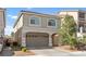 Attractive two-story home with brick-paved driveway, two car garage, elegant architectural details, and lush landscaping at 5419 Holding Ave, Las Vegas, NV 89139