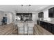Gourmet kitchen with stainless steel appliances, center island, and dark wood cabinets at 5419 Holding Ave, Las Vegas, NV 89139