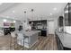 Beautiful kitchen featuring an island with barstool seating and sleek, dark cabinetry at 5419 Holding Ave, Las Vegas, NV 89139