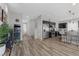 Open living area with sleek floors, stairs to the second story, and an eat-in kitchen at 5419 Holding Ave, Las Vegas, NV 89139
