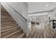 Wood-look staircase leading to the upper level, showcasing a spacious and modern design at 5419 Holding Ave, Las Vegas, NV 89139