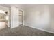 Neutral bedroom with plush carpeting and closet with sliding doors at 5612 Coder Ct, Las Vegas, NV 89118