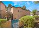 Exterior elevation of the home featuring desert landscaping and a gated entrance at 5612 Coder Ct, Las Vegas, NV 89118