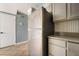 Kitchen featuring stainless steel refrigerator and neutral countertops, creating a functional space at 5612 Coder Ct, Las Vegas, NV 89118