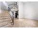 Inviting living space features tile floors and a staircase, providing a warm and welcoming ambiance at 5612 Coder Ct, Las Vegas, NV 89118