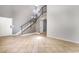 Bright living room features tile floors, stairs, and a staircase, offering an open and inviting space at 5612 Coder Ct, Las Vegas, NV 89118