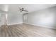 Bright main bedroom featuring wood-look flooring and a ceiling fan at 5612 Coder Ct, Las Vegas, NV 89118