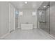 Bright bathroom featuring a soaking tub and glass shower, offering a spa-like experience at 6331 Regina Ridge St, Las Vegas, NV 89149
