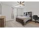Bedroom with a comfortable bed, modern decor, and window with blinds at 6331 Regina Ridge St, Las Vegas, NV 89149
