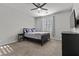 Cozy bedroom featuring a comfortable bed, soft lighting, and window with blinds at 6331 Regina Ridge St, Las Vegas, NV 89149
