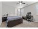 Serene bedroom with a ceiling fan, a comfortable bed, and a functional workspace at 6331 Regina Ridge St, Las Vegas, NV 89149