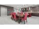 Open dining area features a wooden table with upholstered chairs adjacent to the modern kitchen at 6331 Regina Ridge St, Las Vegas, NV 89149