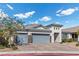 Attractive single-Gathering home with a three-car garage, brick driveway, and well-manicured front yard at 6331 Regina Ridge St, Las Vegas, NV 89149